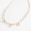 Elegant Pearl & Gold Charm Necklace